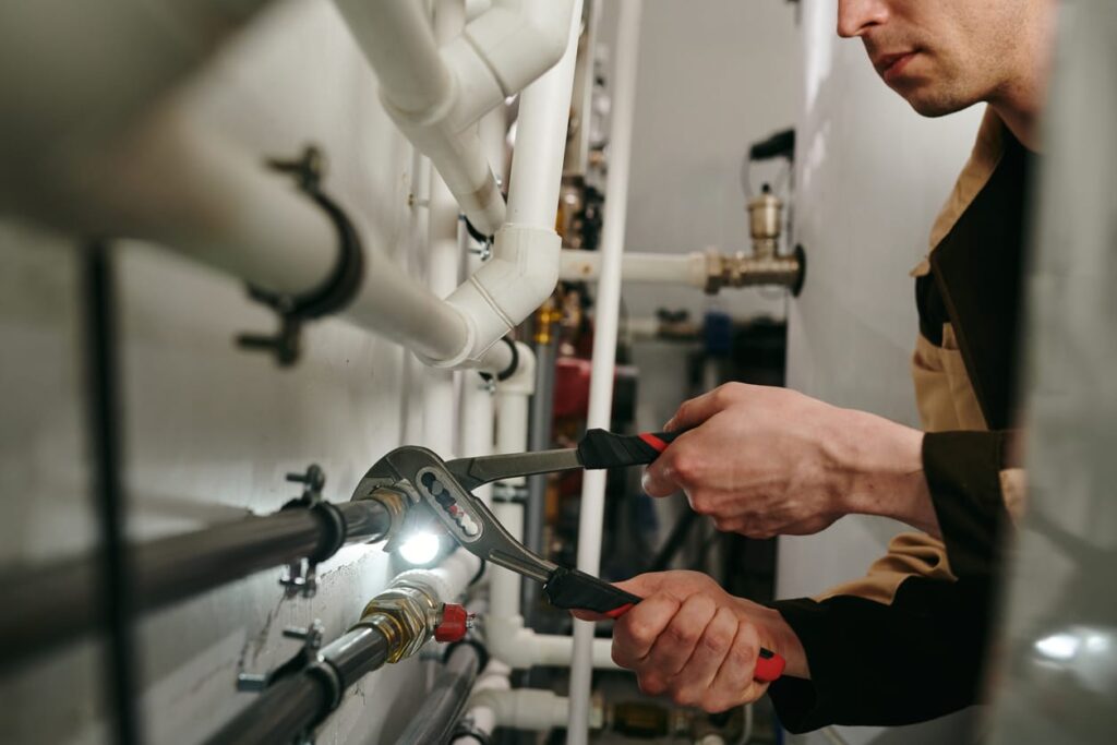 Plumbers maintaining commercial plumbing pipes in Temecula